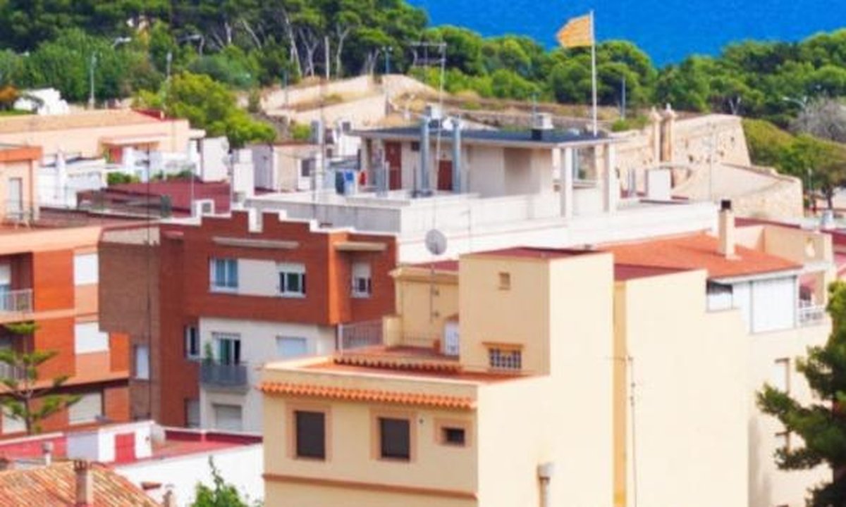 White Mediterranean villa with terracotta roof and sea view