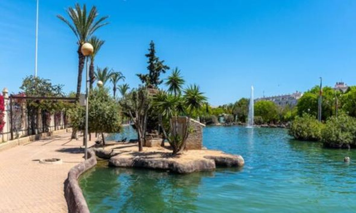 Torrevieja coastline with sun, clouds, and seasonal weather icons