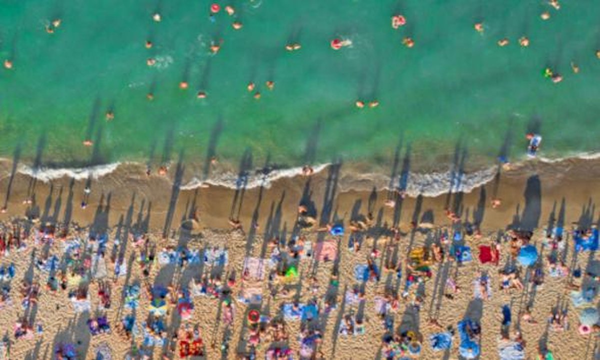 Euro coins, rental contract and rising chart over Spanish apartment building