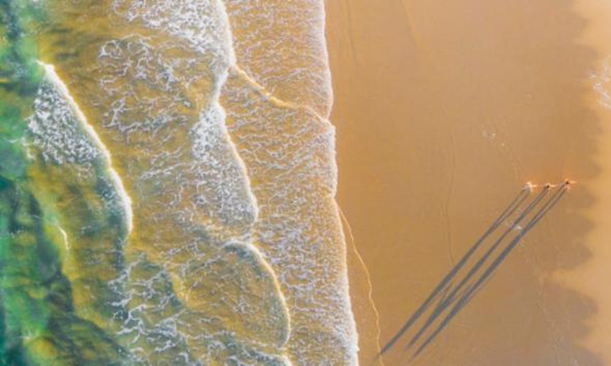 Calculator and measuring tape on apartment floor plan showing cost per m²